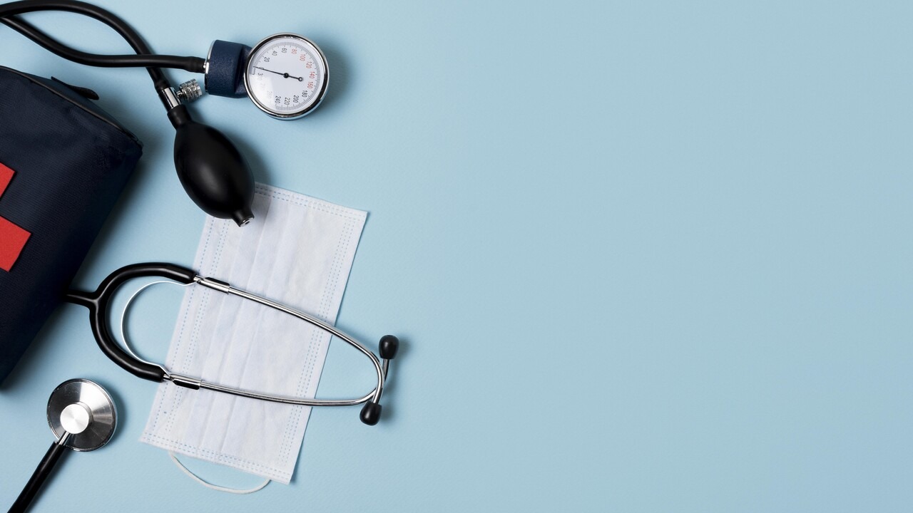 Stethoscope, blood pressure gauge, and medical chart representing condition monitoring